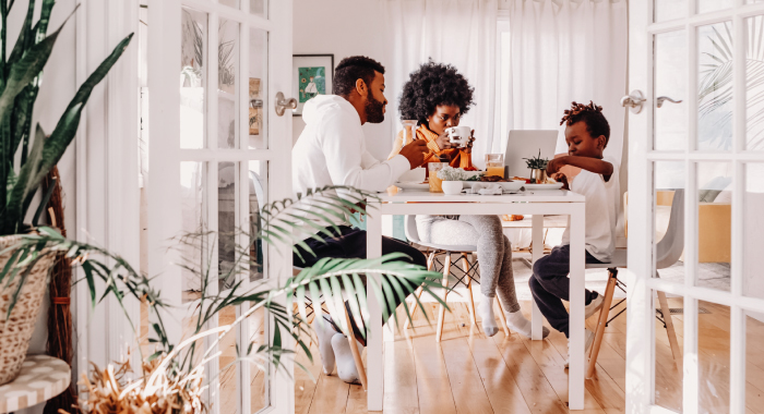 family sitting around a dining table