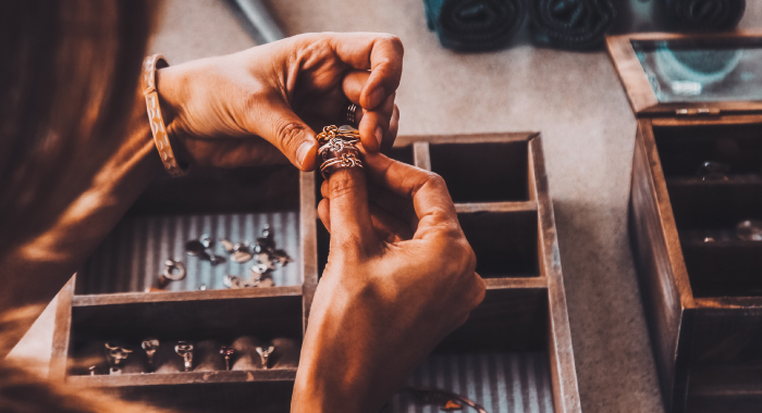 Person looking at rings in a jewelry box