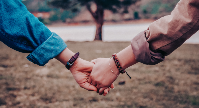 two people holding hands