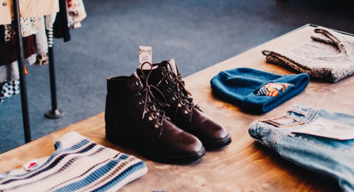 A pair of shoes on a table for sale