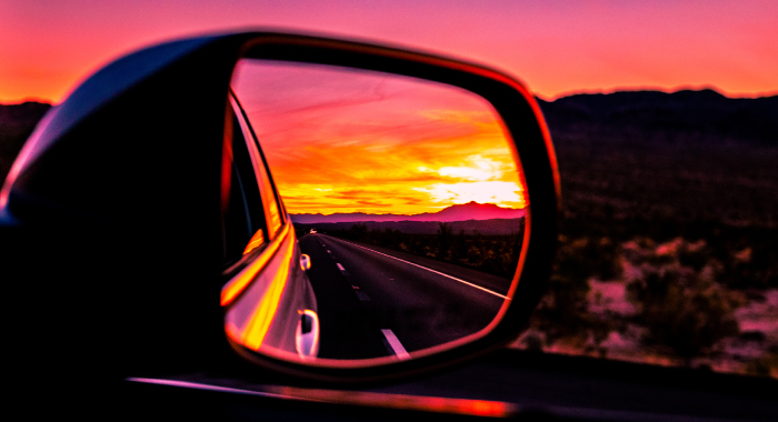 sunset in car side mirror