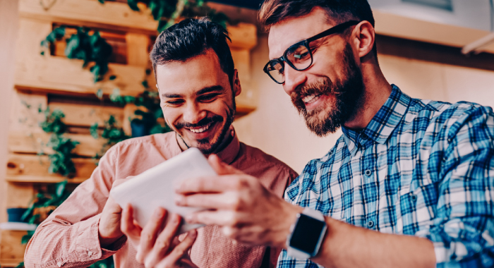 two people looking at a tablet