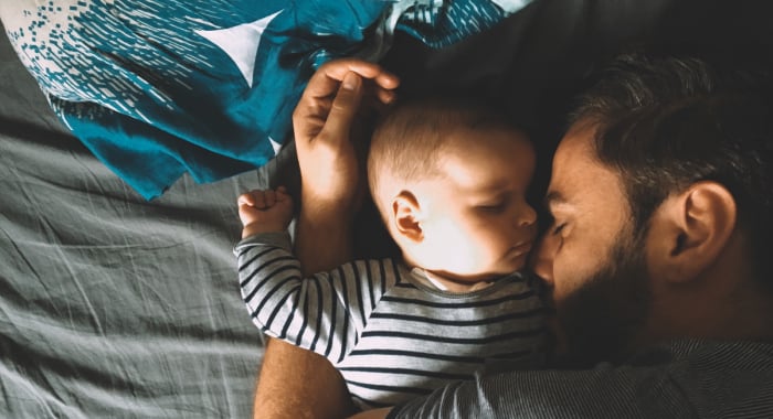 sleeping baby with parent