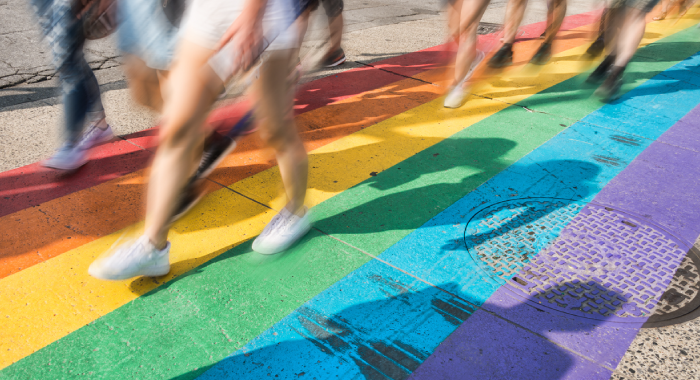 People walking on a rainbow