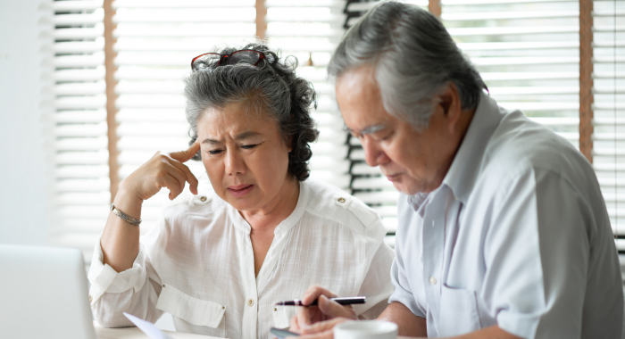 Couple looking at financial paperwork 